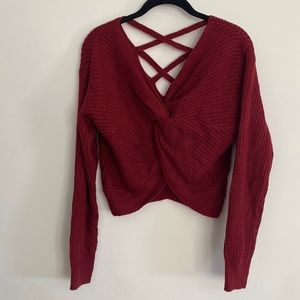 New maroon cropped sweater with twist accent in the front and cut outs in back